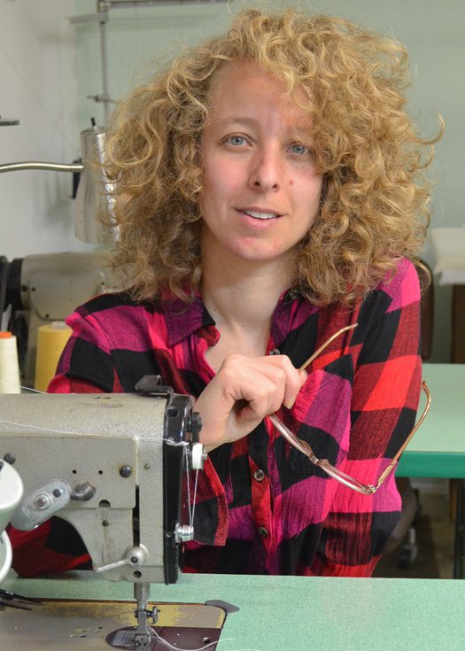 Tara Lynn Scheidet at the sewing machine