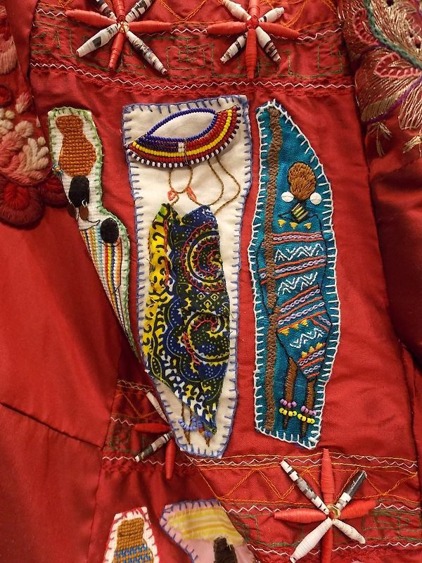 Kenyan Embroidered Ladies on The Red Dress