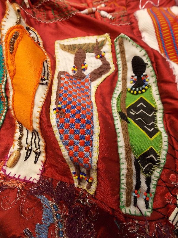Kenyan Embroidered Ladies on The Red Dress